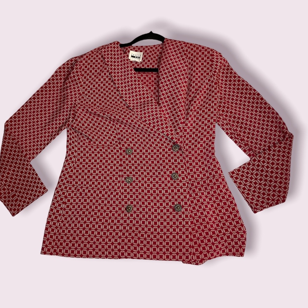 Red and cream blouse with gold buttons